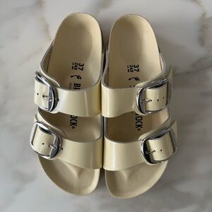 Birkenstock Cream Sandals with Silver Buckles